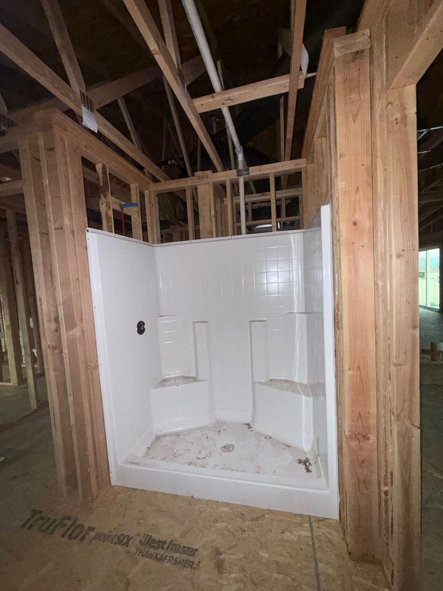 Shower surround set during new construction rough-in